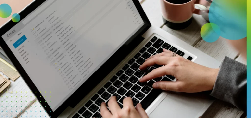 Businesswoman checking email online on a computer.