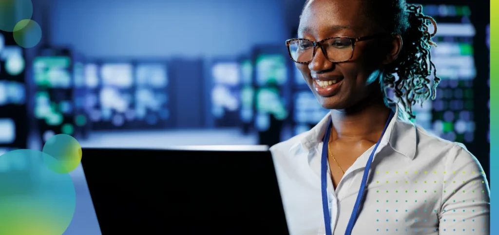 Woman in data center with her laptop.