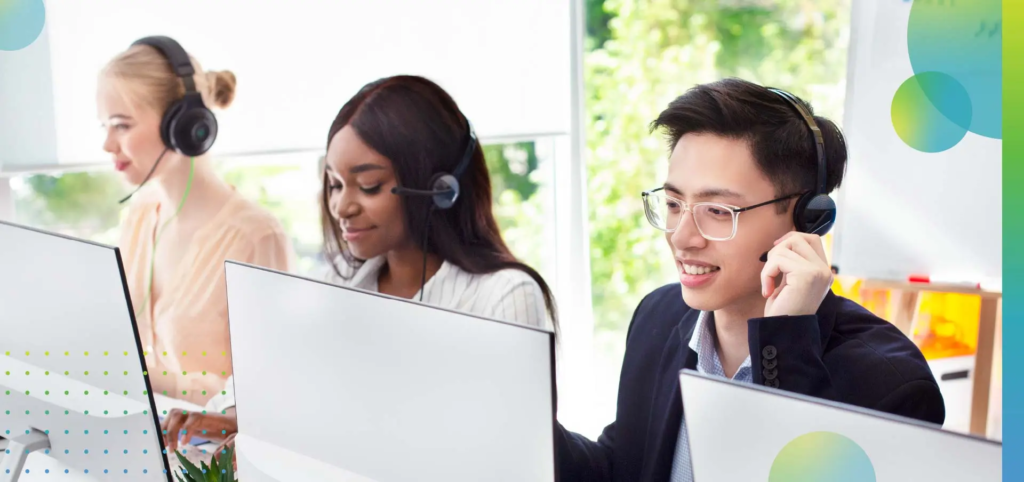 Team of helpline operators with headsets consulting clients at call center.
