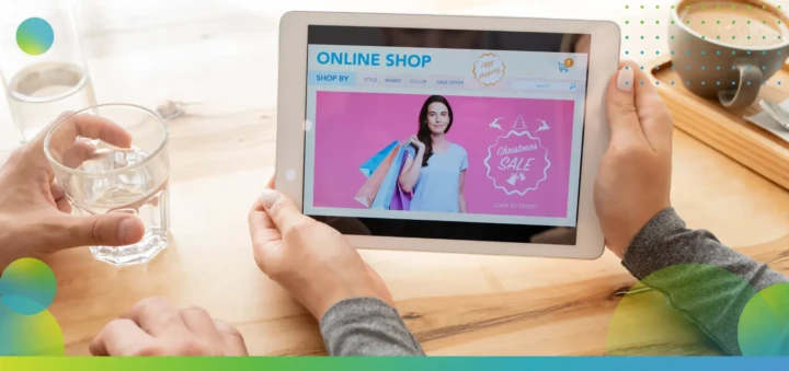 Young female holding digital tablet with online shop