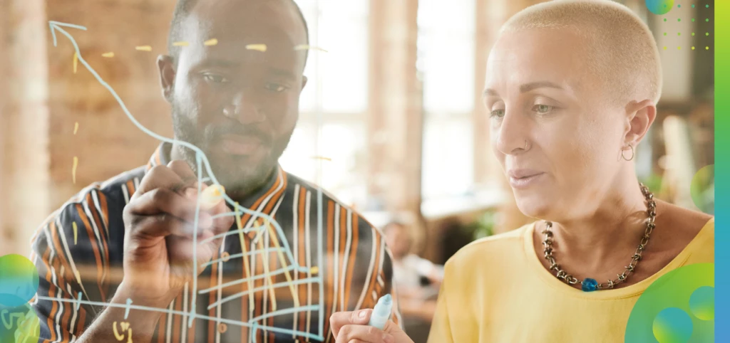 Business people drawing financial graphs.
