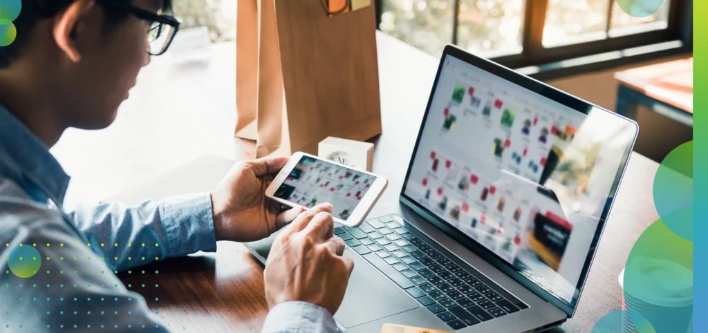 Hands of man are holding smart phones and using laptops computers are entering websites