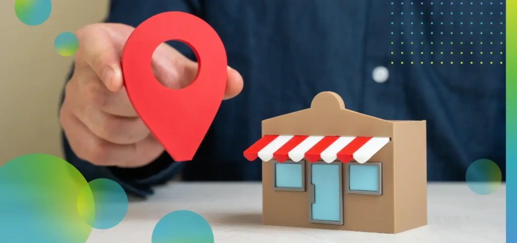 A man holds a geolocation pin near a store.