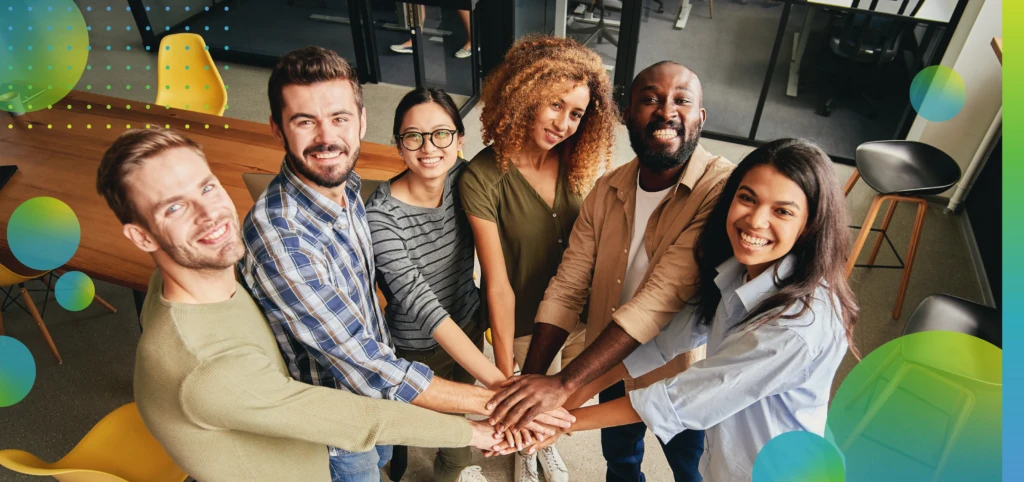 Smiling Colleagues Teamwork with Hands Together at Workplace