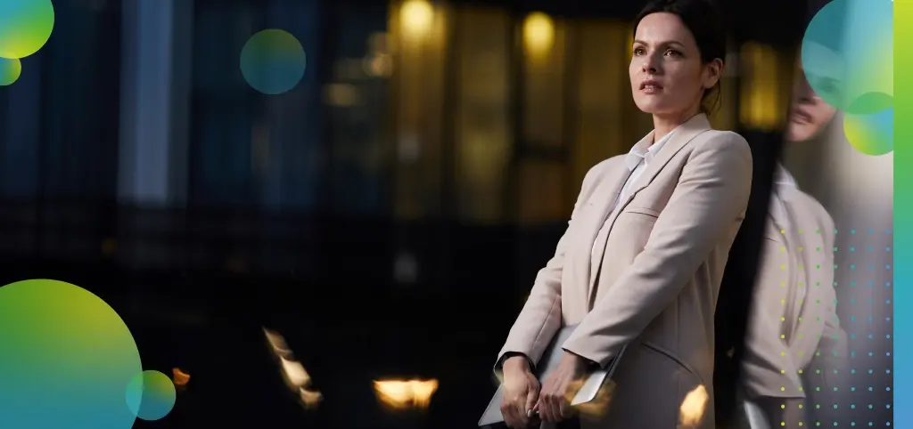 Professional Woman Holding Laptop in Urban Environment 